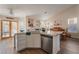 Kitchen features an island, stainless steel appliances, and wood flooring at 1105 Thornfield Ln, Las Vegas, NV 89123