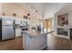 Spacious kitchen with island, stainless steel appliances, and wood flooring at 1105 Thornfield Ln, Las Vegas, NV 89123