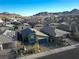 Aerial view of a single-story house in a residential neighborhood at 1297 Paseo Del Oso Ln, Henderson, NV 89002