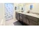 Bathroom with double vanity and shower at 1297 Paseo Del Oso Ln, Henderson, NV 89002