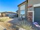 View of house exterior, walkway, and landscaping during daytime at 1297 Paseo Del Oso Ln, Henderson, NV 89002