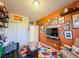 Colorful room with wall art, TV, and comfy seating at 1297 Paseo Del Oso Ln, Henderson, NV 89002