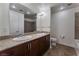 Elegant bathroom with double sinks, granite countertop, and bathtub at 150 Las Vegas Blvd # 1903, Las Vegas, NV 89101