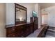 Bedroom with dark wood dresser and large mirror at 150 Las Vegas Blvd # 1903, Las Vegas, NV 89101