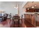 Kitchen features granite counters, wood cabinets, and a dining area with four chairs at 150 Las Vegas Blvd # 1903, Las Vegas, NV 89101