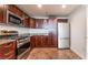 Modern kitchen with stainless steel appliances and dark wood cabinets at 150 Las Vegas Blvd # 1903, Las Vegas, NV 89101