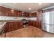 Modern kitchen with stainless steel appliances and dark wood cabinets at 150 Las Vegas Blvd # 1903, Las Vegas, NV 89101