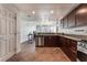 Modern kitchen with stainless steel appliances and dark wood cabinets at 150 Las Vegas Blvd # 1903, Las Vegas, NV 89101