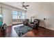 Living room with hardwood floors, two leather chairs, and a large window at 150 Las Vegas Blvd # 1903, Las Vegas, NV 89101