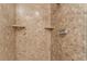 Shower with beige marble-style walls and built-in shelves at 150 Las Vegas Blvd # 1903, Las Vegas, NV 89101