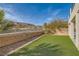 Artificial turf backyard with a block wall and mountain views at 1738 Sonoran Bluff Ave, Henderson, NV 89014