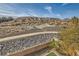 View of a rocky hillside from a backyard at 1738 Sonoran Bluff Ave, Henderson, NV 89014