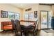 Inviting dining area with booth seating, wood floors, and sliding glass door to the outside at 1738 Sonoran Bluff Ave, Henderson, NV 89014