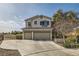 Two-story house with three-car garage and landscaped yard at 1738 Sonoran Bluff Ave, Henderson, NV 89014