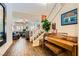 Grand foyer with wood flooring, a staircase, and seamless access to the open living area, creating a welcoming ambiance at 1738 Sonoran Bluff Ave, Henderson, NV 89014