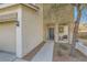 Covered front porch with stone accents and sitting area at 1738 Sonoran Bluff Ave, Henderson, NV 89014