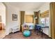 Cozy sitting area with brown carpet, a desk, and window at 1738 Sonoran Bluff Ave, Henderson, NV 89014