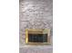 Fireplace with stone surround and brass screen at 1901 Calle De Espana, Las Vegas, NV 89102