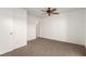 Bright bedroom featuring ceiling fan and neutral carpeting at 2204 Kendall Hill Ave, Las Vegas, NV 89106