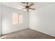 Spacious bedroom with ceiling fan and window at 2204 Kendall Hill Ave, Las Vegas, NV 89106