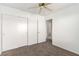 Bedroom with ceiling fan, carpet, and access to bathroom at 2204 Kendall Hill Ave, Las Vegas, NV 89106