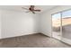 Spacious bedroom with ceiling fan and sliding glass door to patio at 2204 Kendall Hill Ave, Las Vegas, NV 89106