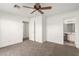 Bedroom with ceiling fan, carpet, and access to bathroom and hallway at 2204 Kendall Hill Ave, Las Vegas, NV 89106