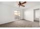 Bedroom with ceiling fan, patio access, and carpet flooring at 2204 Kendall Hill Ave, Las Vegas, NV 89106