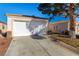 Attached garage with a large driveway at 2204 Kendall Hill Ave, Las Vegas, NV 89106