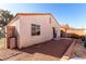 Rear view of house showing a small patio and yard at 2204 Kendall Hill Ave, Las Vegas, NV 89106