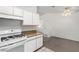 Kitchen with granite countertops, white cabinets, and view to dining area at 2204 Kendall Hill Ave, Las Vegas, NV 89106