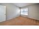 Spacious bedroom featuring a window and neutral walls at 2360 Pickwick Dr, Henderson, NV 89014