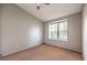 Simple bedroom with neutral walls and window at 2360 Pickwick Dr, Henderson, NV 89014