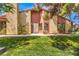 Front view of the house with a well-maintained lawn at 2360 Pickwick Dr, Henderson, NV 89014