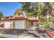 Front view of a two-car garage townhouse at 2360 Pickwick Dr, Henderson, NV 89014