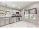 Kitchen with stainless steel appliances and white cabinets at 2360 Pickwick Dr, Henderson, NV 89014