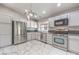 Modern kitchen featuring stainless steel appliances and marble flooring at 2360 Pickwick Dr, Henderson, NV 89014