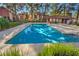 Community pool with lounge chairs and landscaping at 2360 Pickwick Dr, Henderson, NV 89014