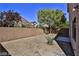 Landscaped backyard with gravel and a small patio area at 2892 Rothesay Ave, Henderson, NV 89044