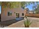 House backyard with gravel, trees and patio at 2892 Rothesay Ave, Henderson, NV 89044