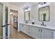 Spa-like bathroom with double sinks, quartz countertops and a view at 2892 Rothesay Ave, Henderson, NV 89044