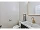 Modern bathroom with gold faucet and dark vanity at 2892 Rothesay Ave, Henderson, NV 89044