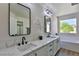 Modern bathroom with double vanity, quartz countertop, and soaking tub at 2892 Rothesay Ave, Henderson, NV 89044