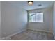 Bright bedroom with window and neutral colored carpet at 2892 Rothesay Ave, Henderson, NV 89044