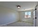 Well-lit bedroom featuring a window and a door at 2892 Rothesay Ave, Henderson, NV 89044