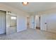 Bright bedroom with mirrored closet doors and access to bathroom at 2892 Rothesay Ave, Henderson, NV 89044