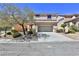 Two-story house with a landscaped yard and attached garage at 2892 Rothesay Ave, Henderson, NV 89044