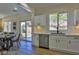 Modern kitchen with white cabinets and stainless steel appliances at 2892 Rothesay Ave, Henderson, NV 89044