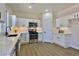 Newly remodeled kitchen boasting white cabinets, quartz countertops, and a stylish backsplash at 2892 Rothesay Ave, Henderson, NV 89044