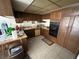 Galley style kitchen with wood cabinets and built in oven at 3345 Medina Ct, Las Vegas, NV 89121